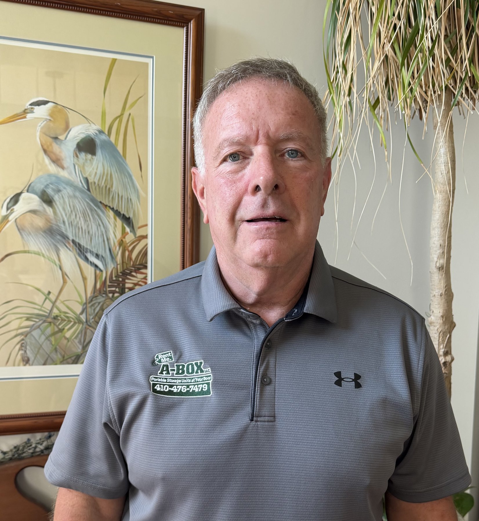 Steve, owner of A Box Portable Storage, wearing an A Box polo shirt