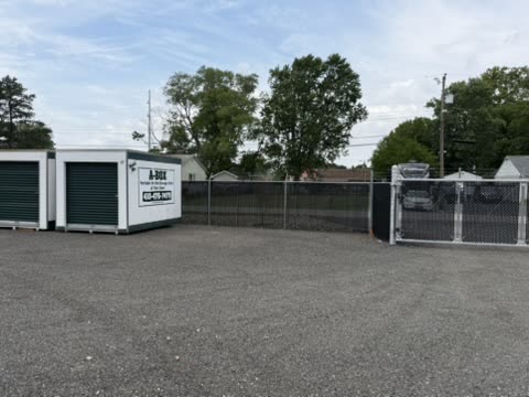 A Box portable storage containers beside the fenced gravel lot at the secured Cambridge, Maryland facility