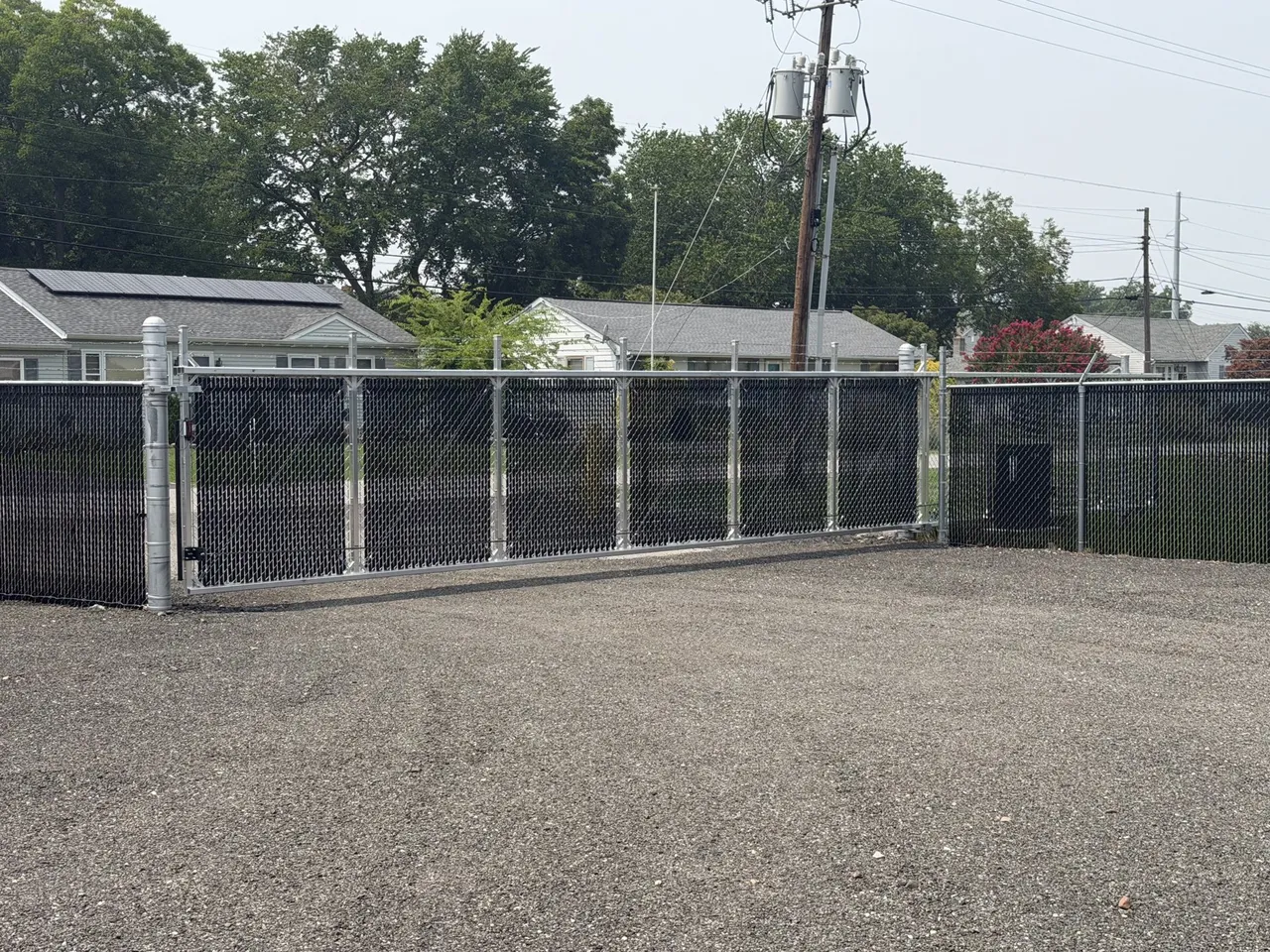 Automated sliding security gate at A Box's fenced storage yard in Cambridge, Maryland