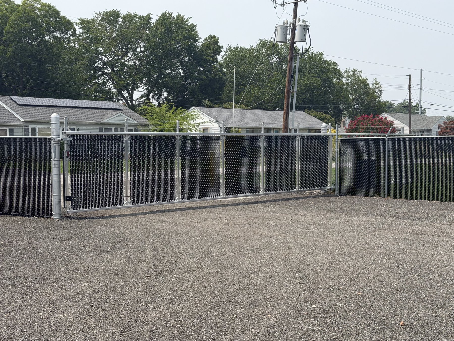 Automated sliding security gate at A Box's fenced storage yard in Cambridge, Maryland